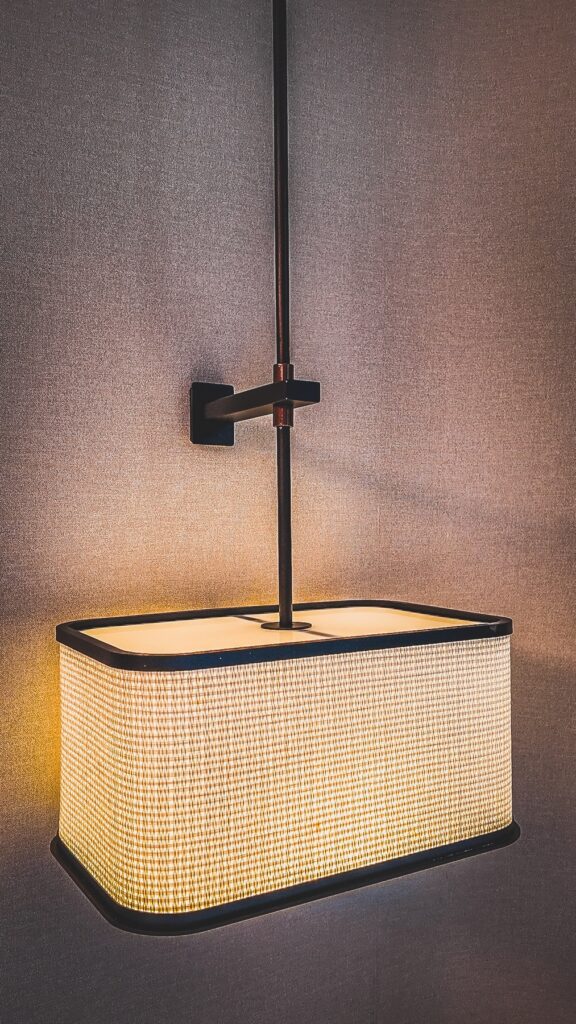 Decorative textured lamps illuminating a stylish bedroom at Amari Kuala Lumpur, enhancing comfort and ambiance.